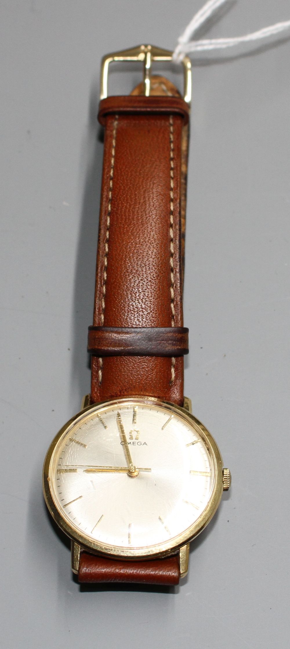 A gentlemans Omega manual wind wrist watch, on associated strap,